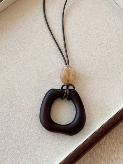 Long Pendant Necklace With Marbled Design